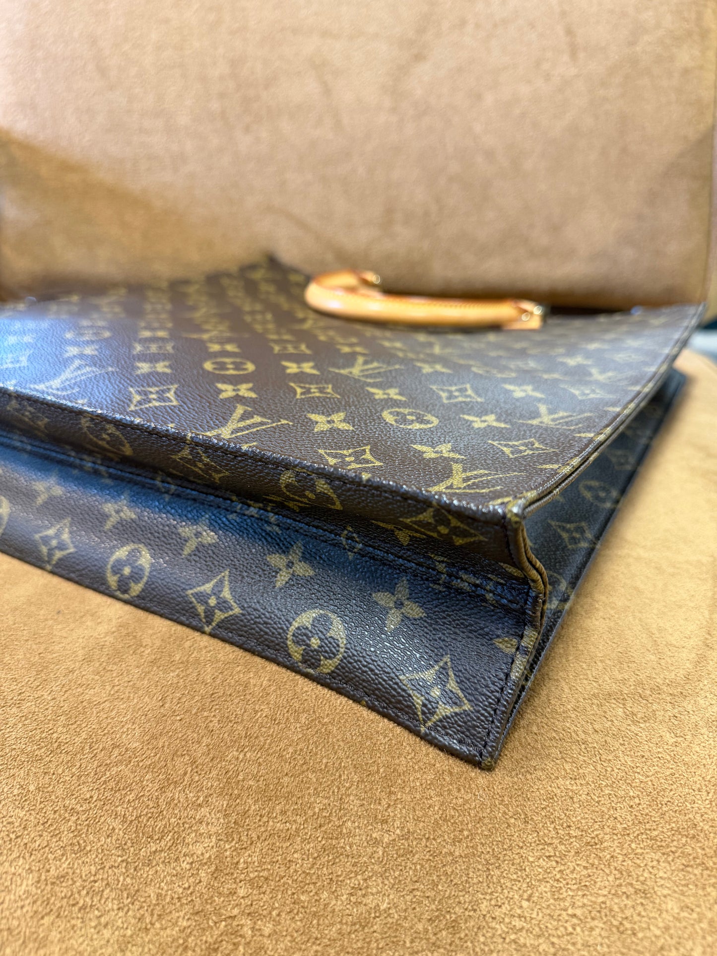 Louis Vuitton Monogram coated canvas with vachetta leather trim