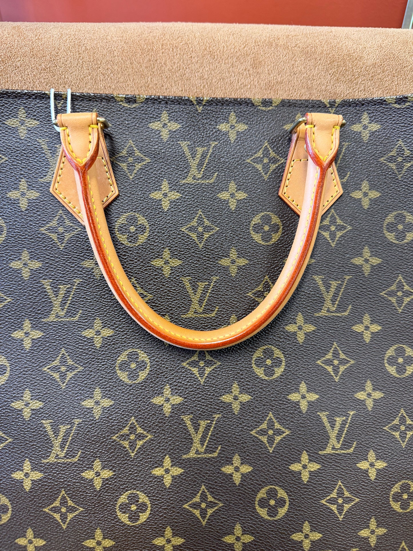 Louis Vuitton Monogram coated canvas with vachetta leather trim
