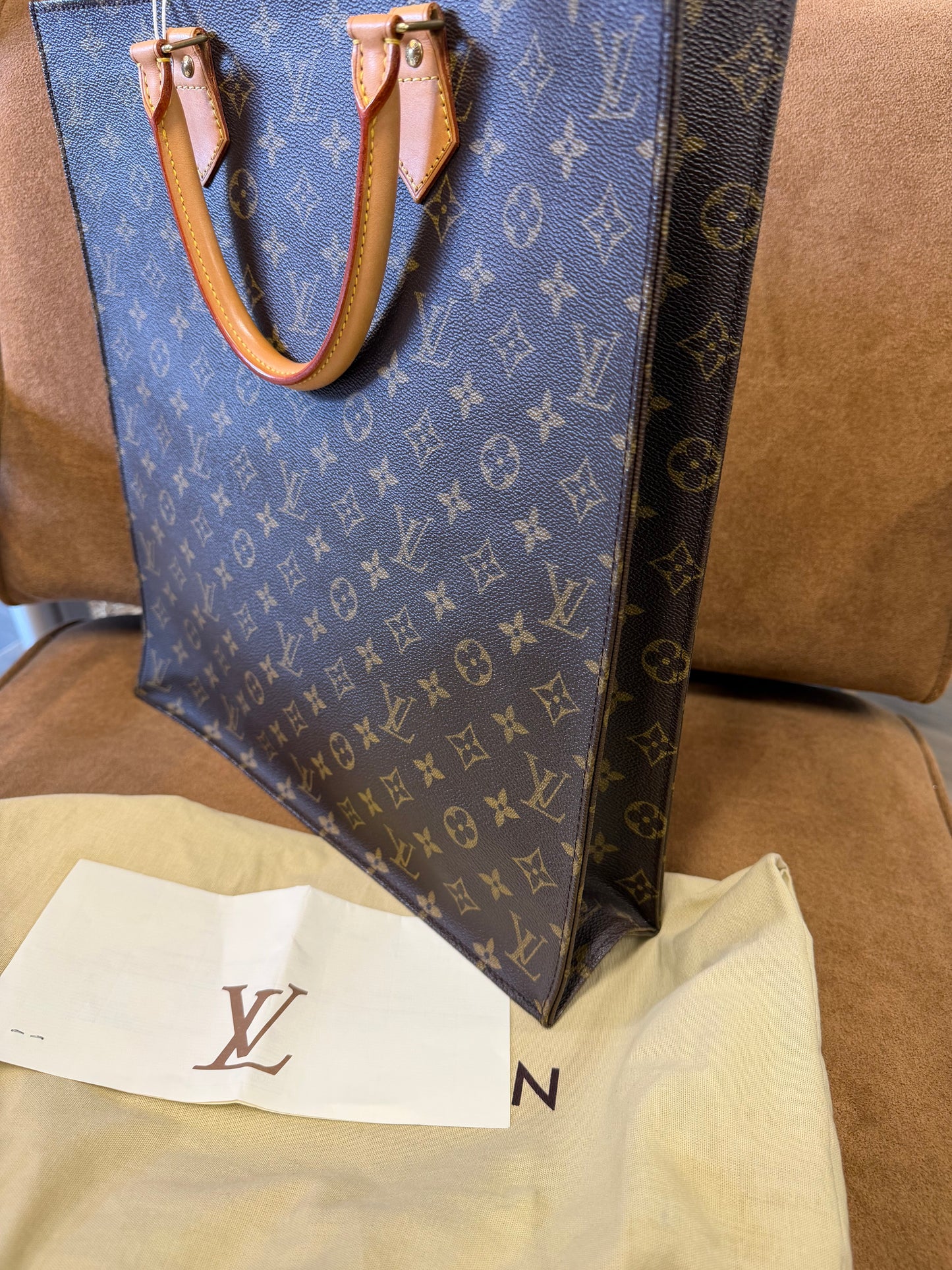 Louis Vuitton Monogram coated canvas with vachetta leather trim