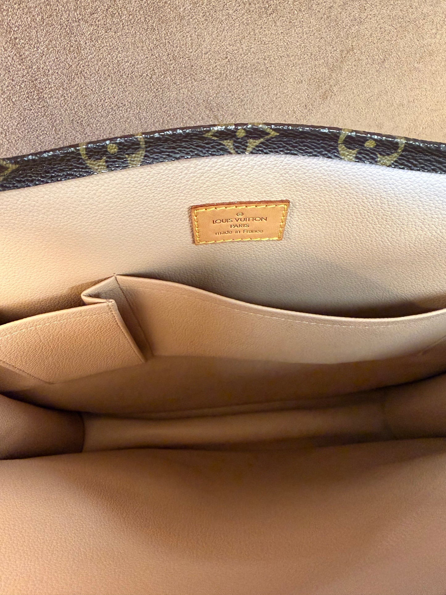 Louis Vuitton Monogram coated canvas with vachetta leather trim