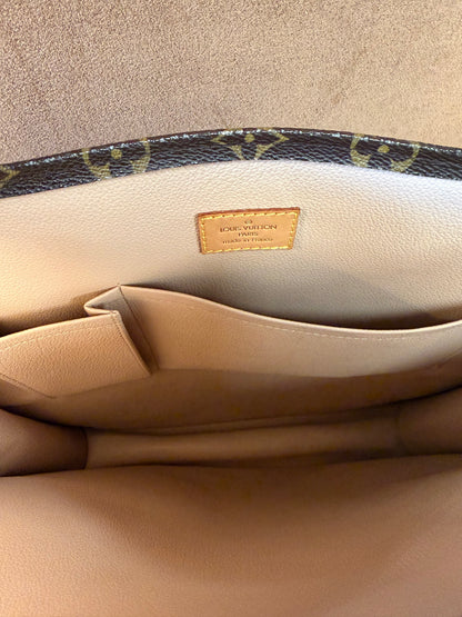 Louis Vuitton Monogram coated canvas with vachetta leather trim